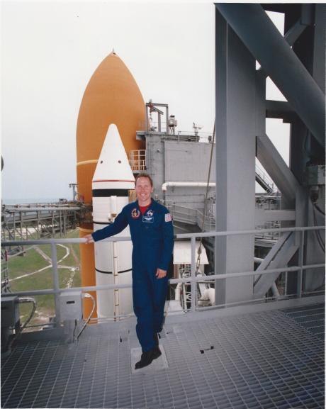 Tom Jones with Endeavou'rs SRB and ET stack on Launch Pad 39A. The orbiter is enclosed by the gray protective structure. (NASA ksc-394c-1160.22)