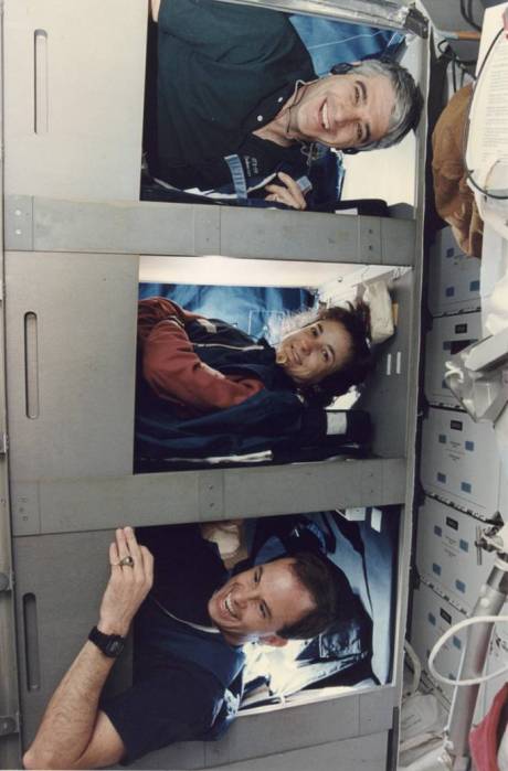 The SRL-1 Red Shift of Sid Gutierrez, Linda Godwin, and Kevin Chilton (bottom) prepares for their cozy night in Endeavour's sleep stations. (NASA STS059-22-004)